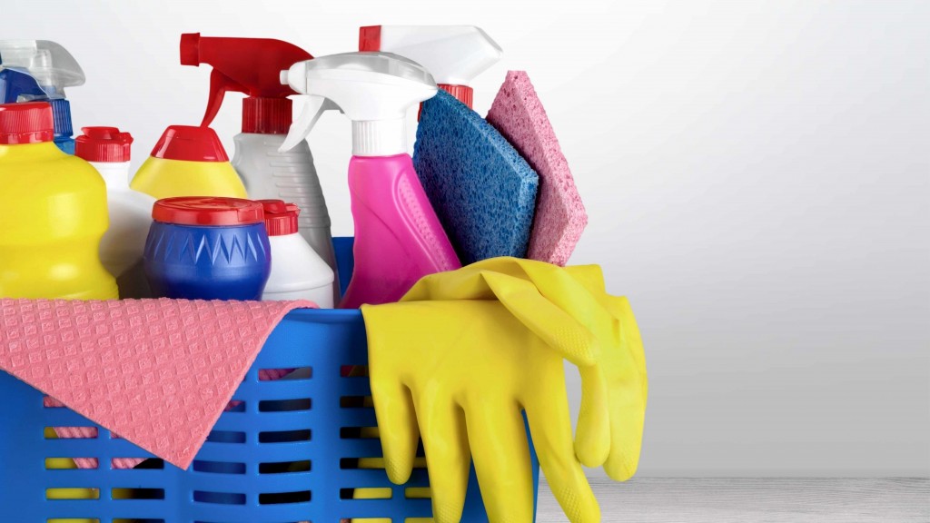 kitchen basket of cleaning supplies, spray bottles, chemicals