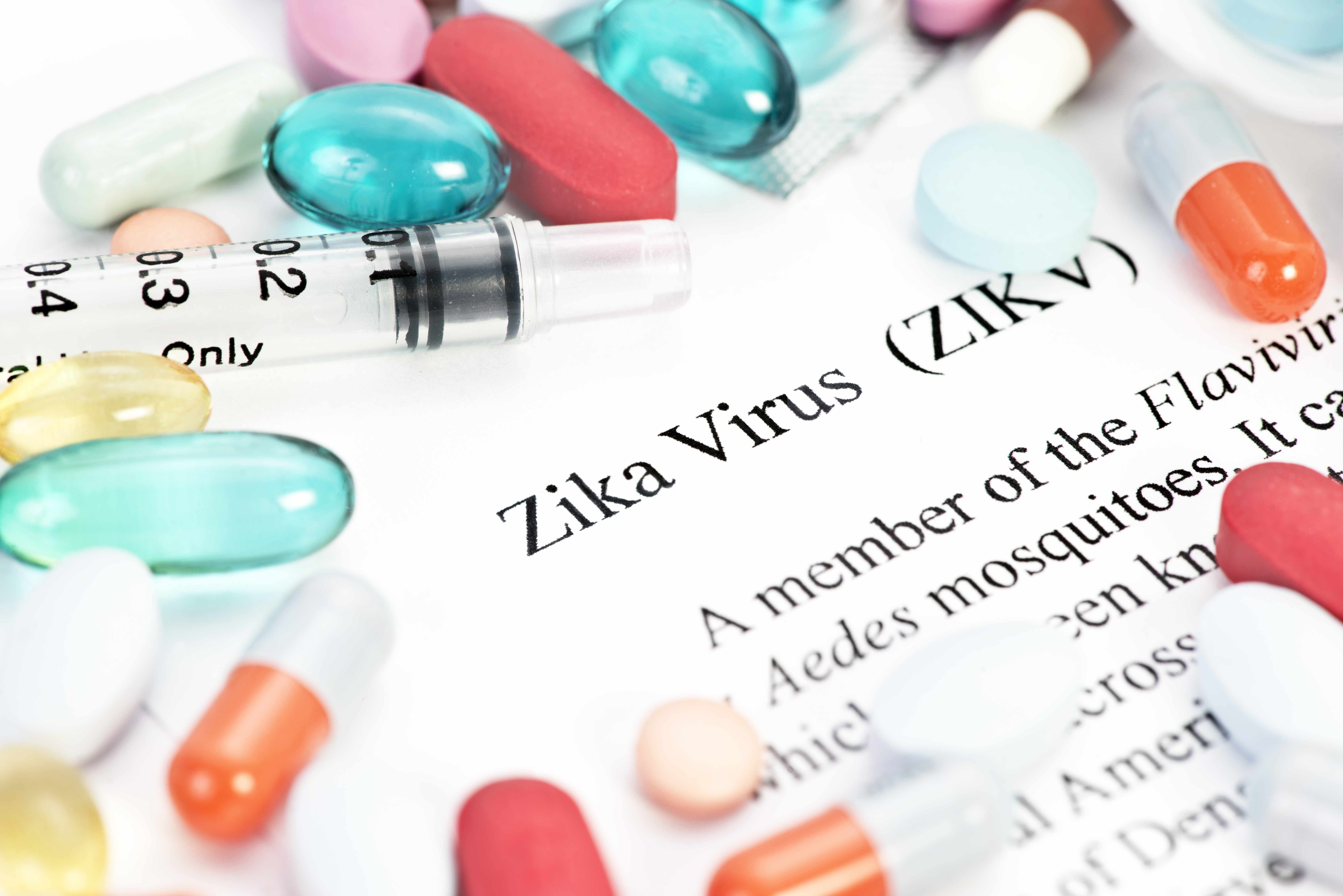 word definition of zika virus with a syringe and pills