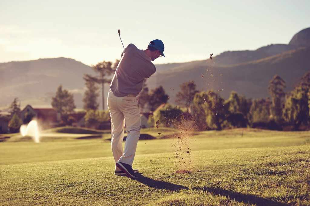 a golfer taking a full golf swing