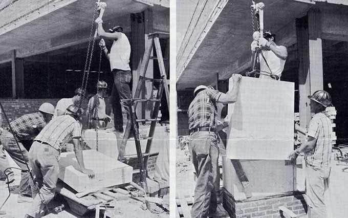workers placing a corner stone on the 19th floor of the Mayo Building