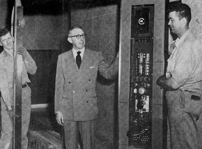 a 1956 photograph of General Service’s Clyde Crume and Westinghouse elevator men Elton Butlin and Floyd Dawley, at work in a new patient elevator
