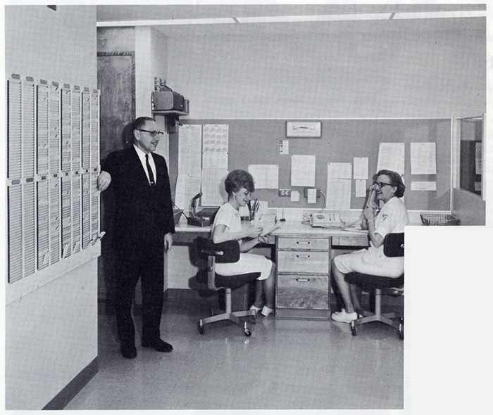 a 1967 photo of Dr. Gordon Martin, consultant in Physical Medicine; Ellen Mittelstadt, desk attendant; and Esther Swartz, Physical Therapy supervisor