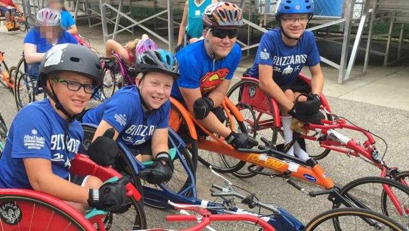 spina bifida patient Ty Wiberg and his team riding bicycles