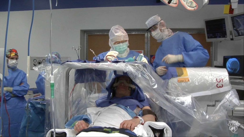 surgeons perform surgery on an awake patient brain