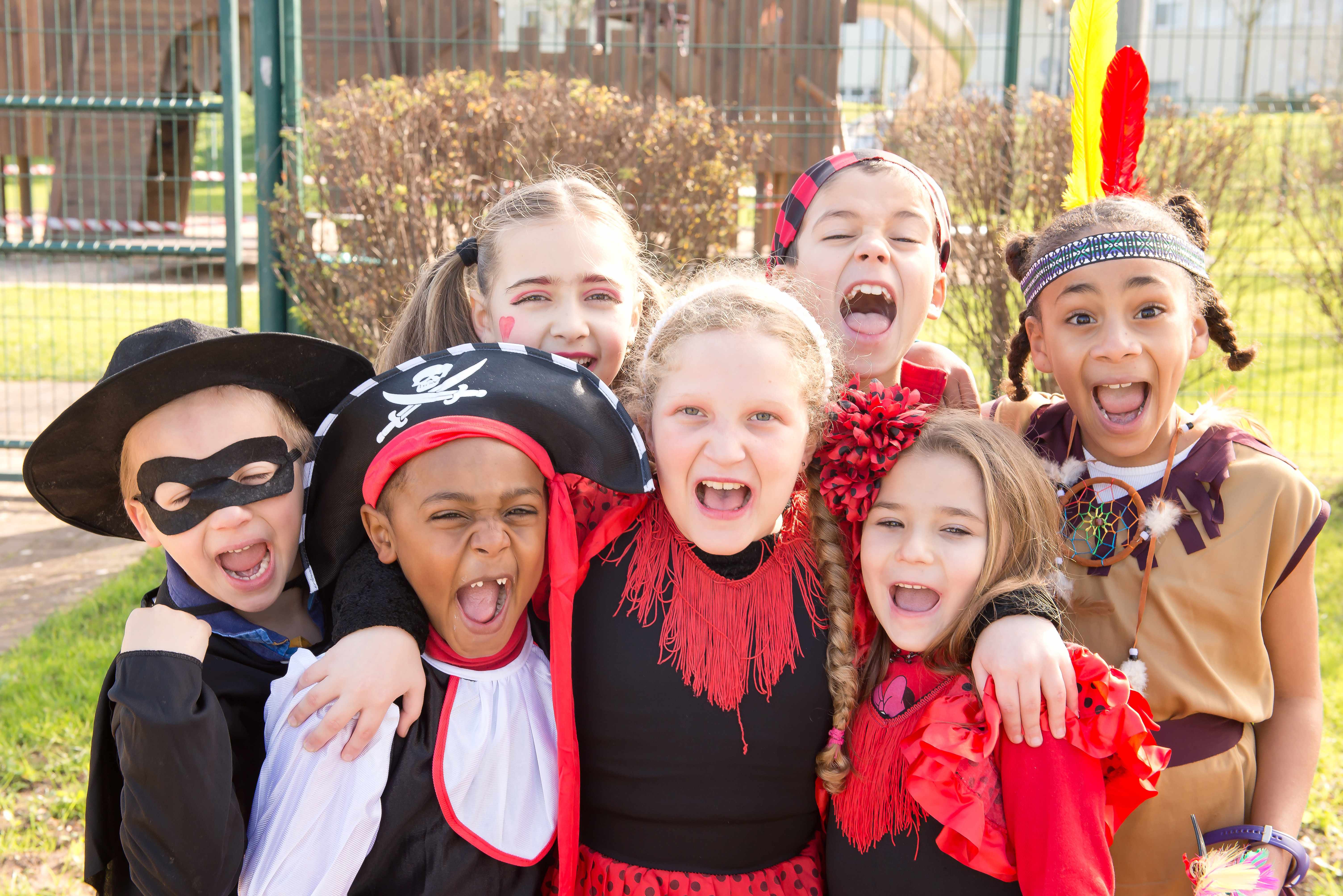 a group of children in Halloween costumes