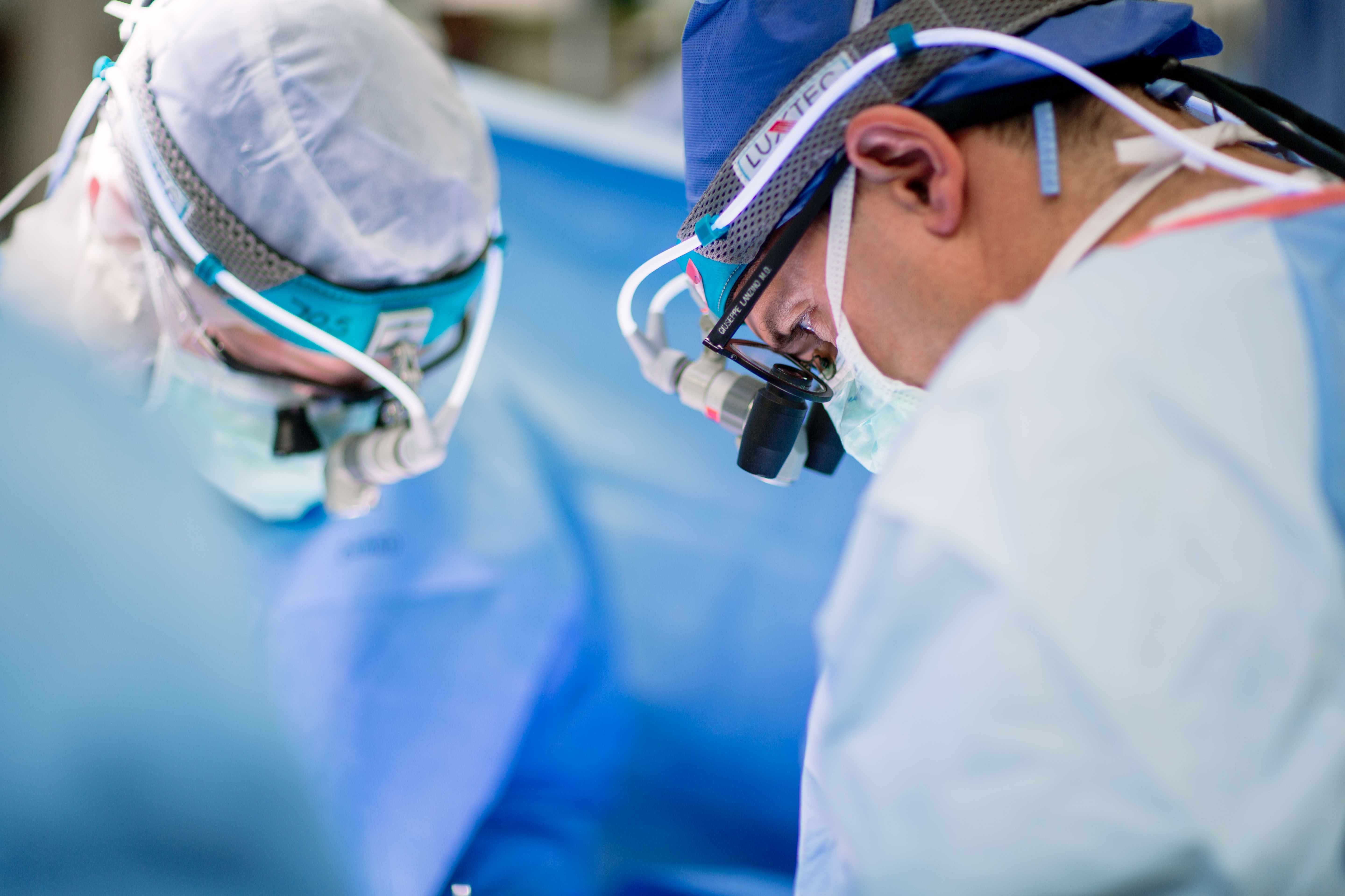 Close-up of two surgeons in the operating room