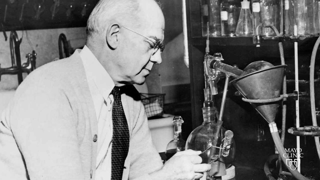 A black and white photo of chemist edward kendall in a lab.