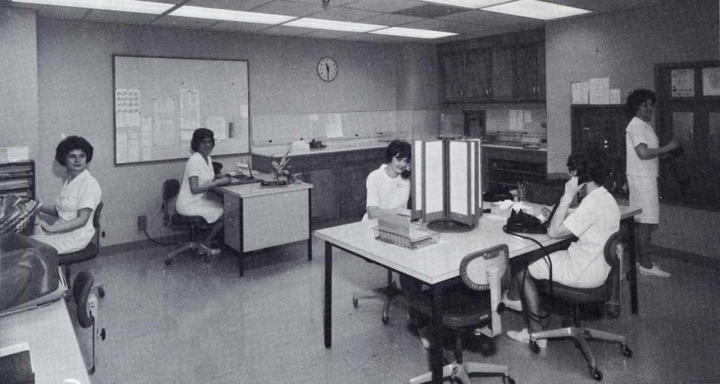 a 1967 photo of Myrna Jennison, Hazel Myers (supervisor), Sandra Schaefer, Kathleen Bingham and Diane Atkinson working in the Rochester Methodist Hospital history desk area