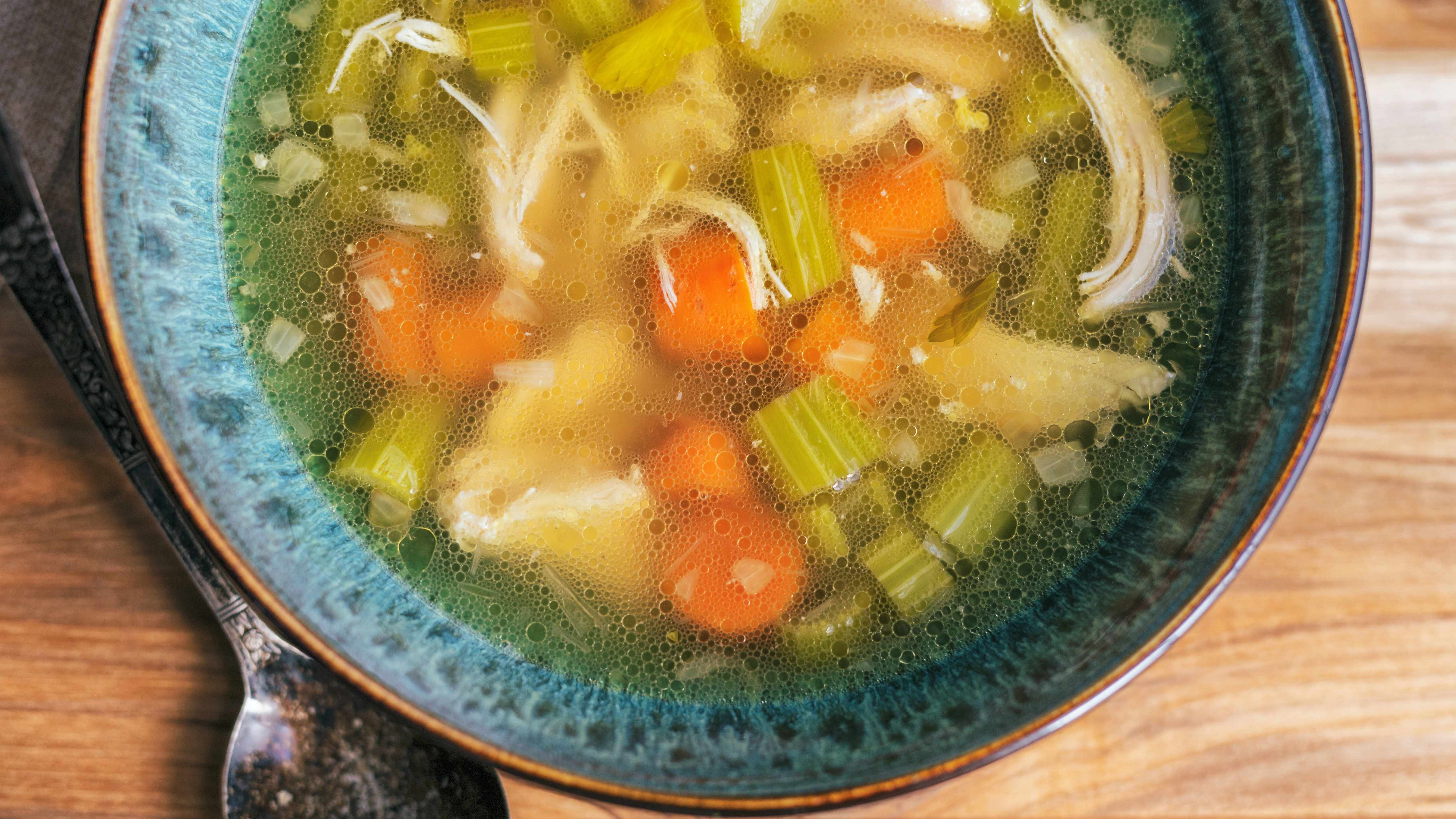 a bowl of homemade chicken broth soup