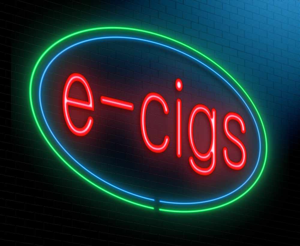 a neon sign saying e-cigs, advertising e-cigarettes