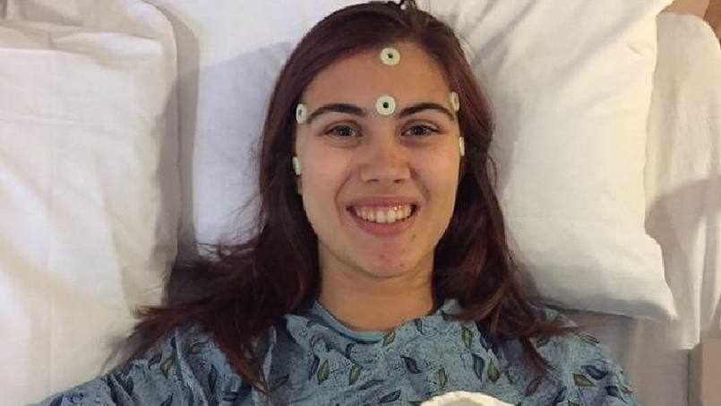 brain cancer patient Kelly Leibold in her hospital bed