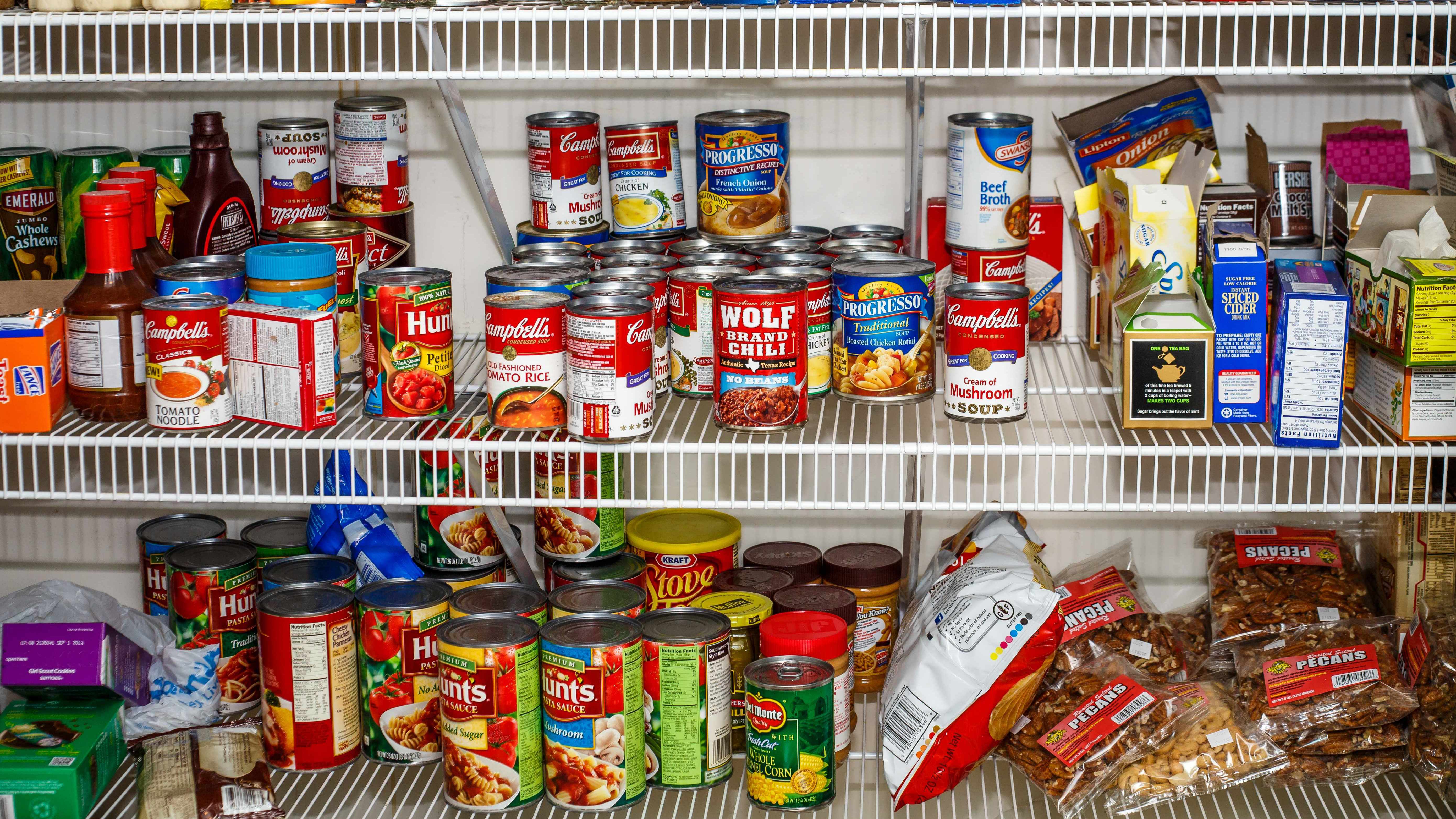 kitchen pantry shelf filled with canned foods and packaged items