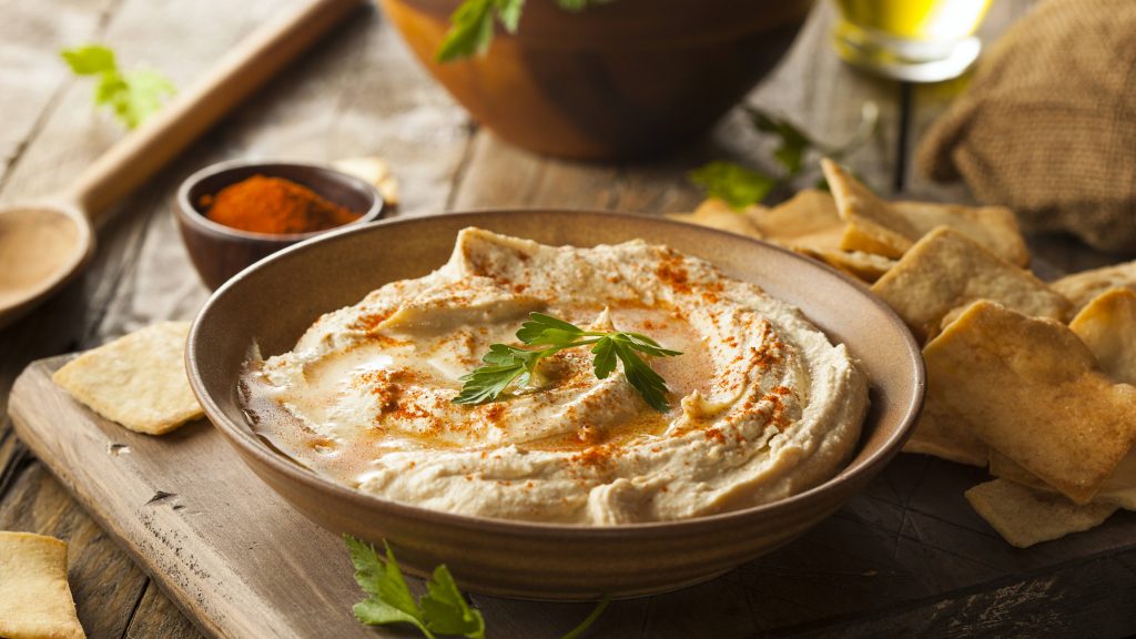 an appetizer bowl filled with a healthy hummus snack