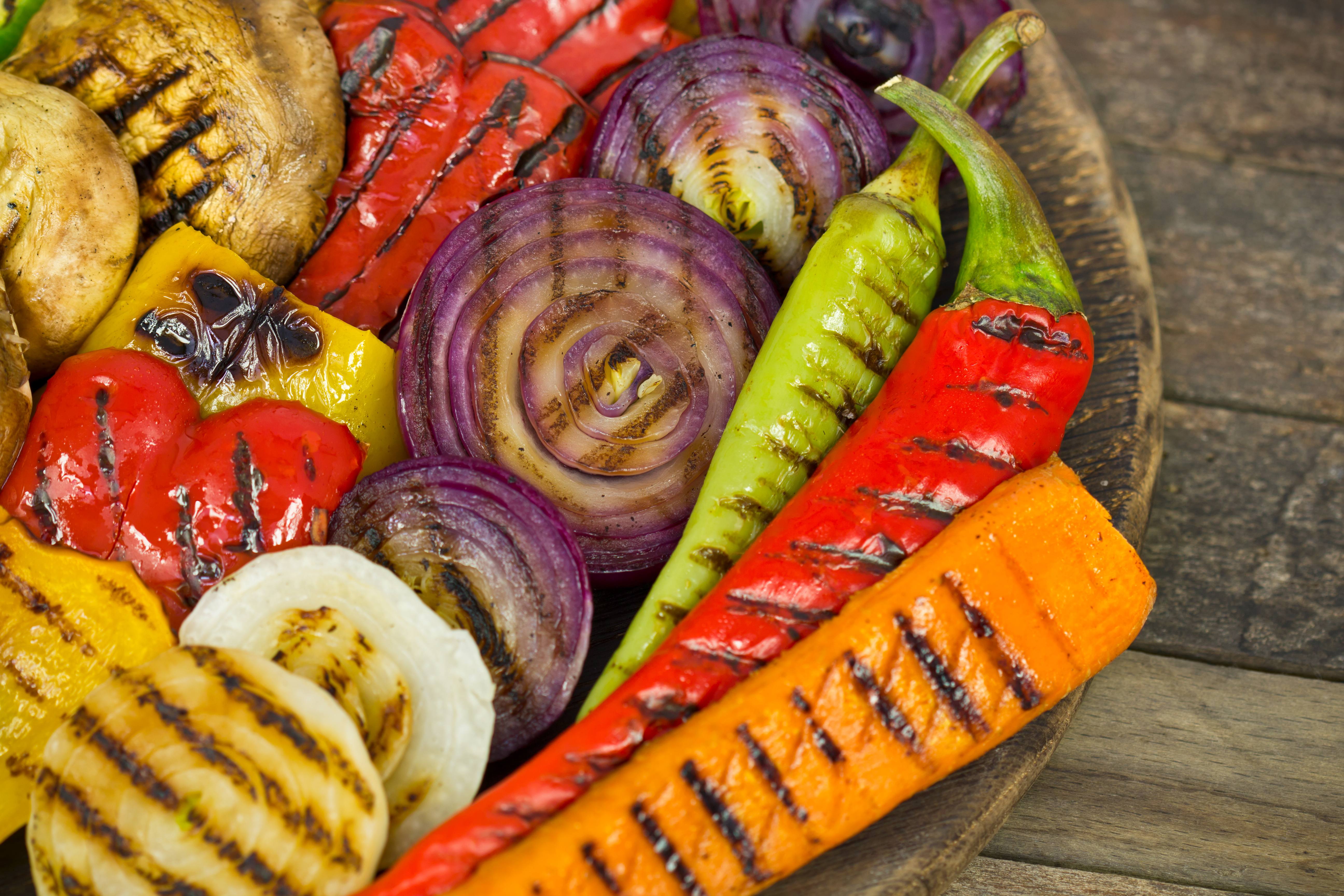 a wooden bowl of freshly roasted vegetables