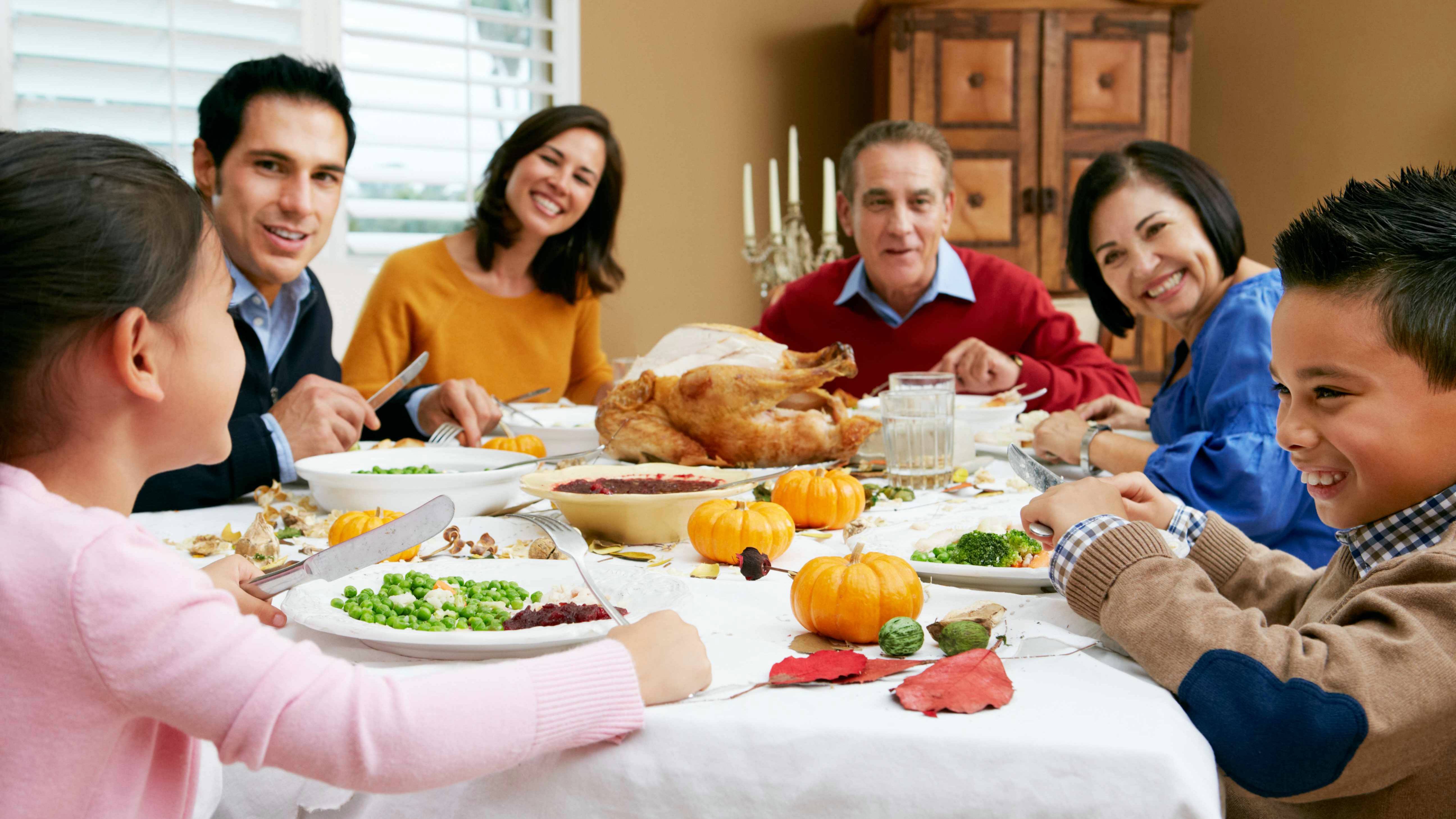 multi-generational family having healthy Thanksgiving dinner