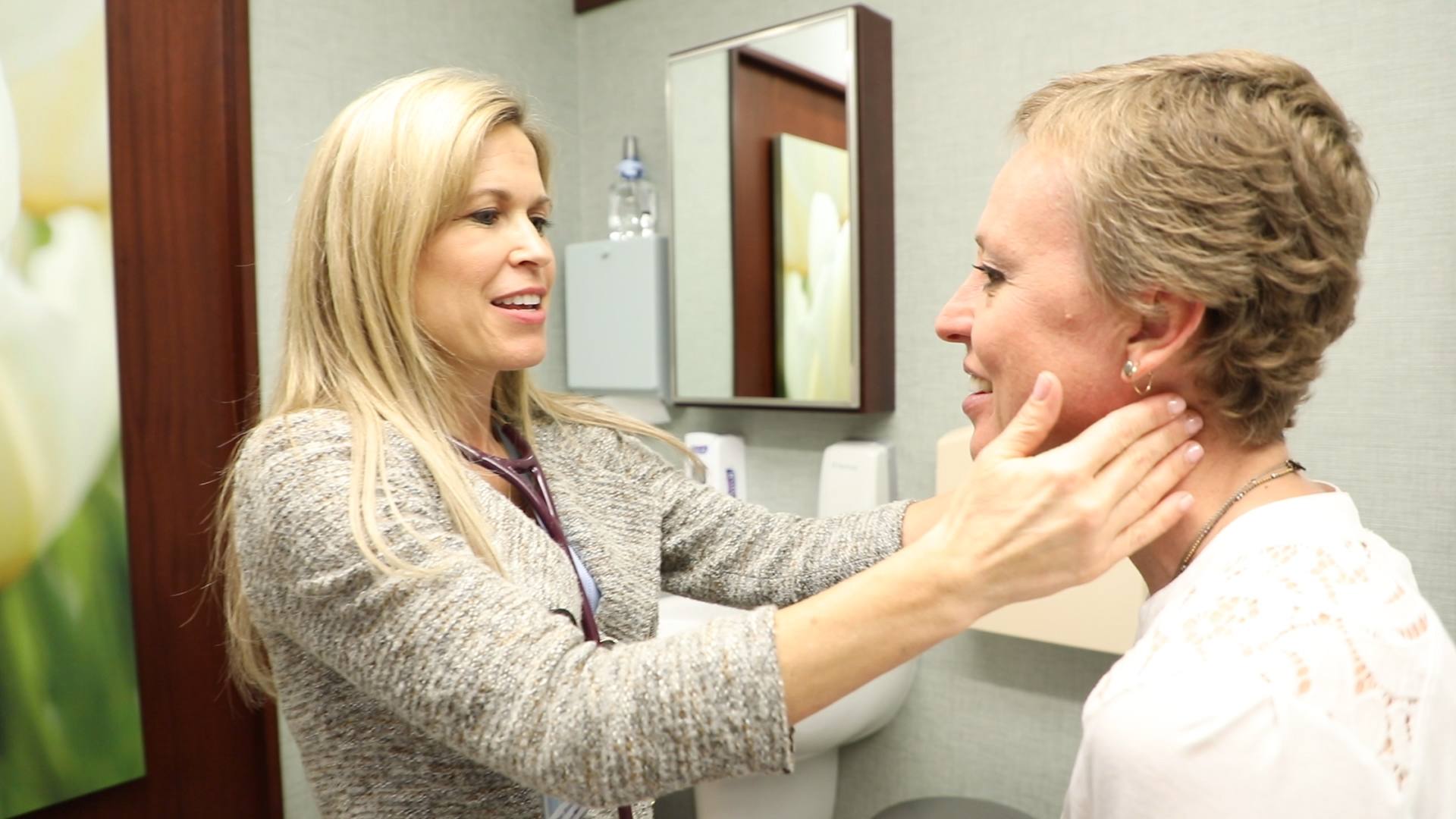 Dr. Dawn Mussallem in her office consulting with and examining breast cancer patient Jennifer Deaderick