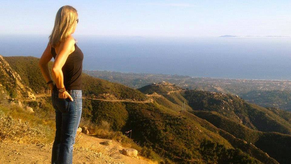 cancer and integrative medicine patient Jennifer Deaderick on a hillside overlooking a valley in California