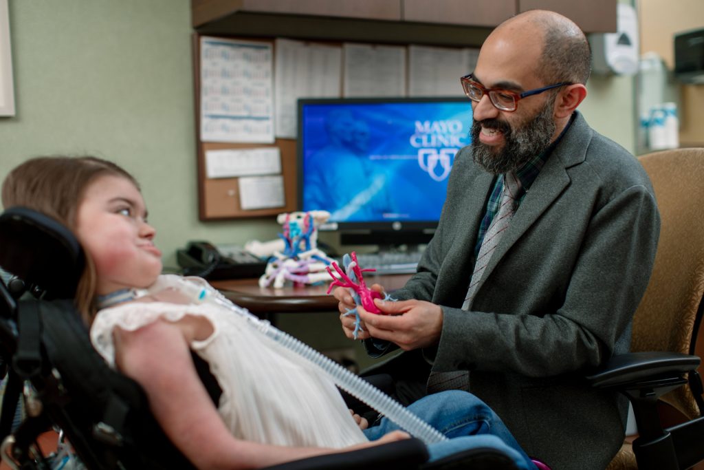 Dr. Karthik Balakrishnan and a patient discussing a 3-D model