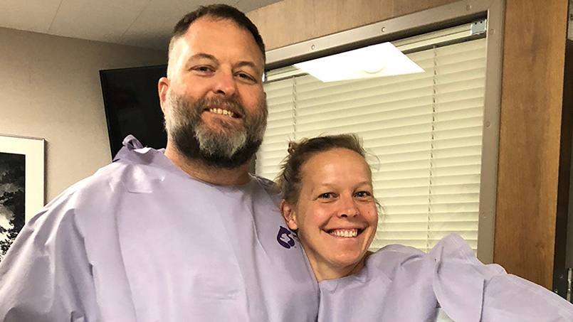 kidney transplant couple in hospital gowns before surgery, Michelle and Will Young 