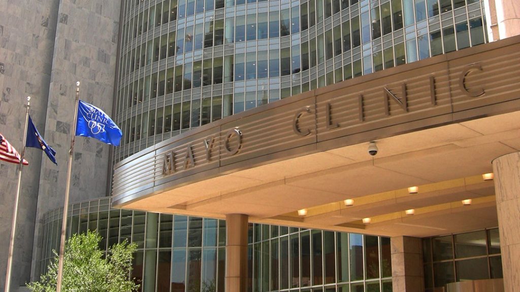 Entrance to Mayo Clinic Gonda building with flags flying outside