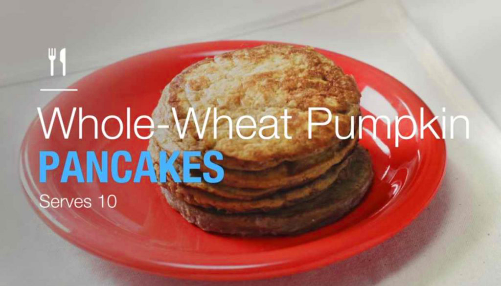 whole wheat pumpkin pancakes on an orange breakfast plate
