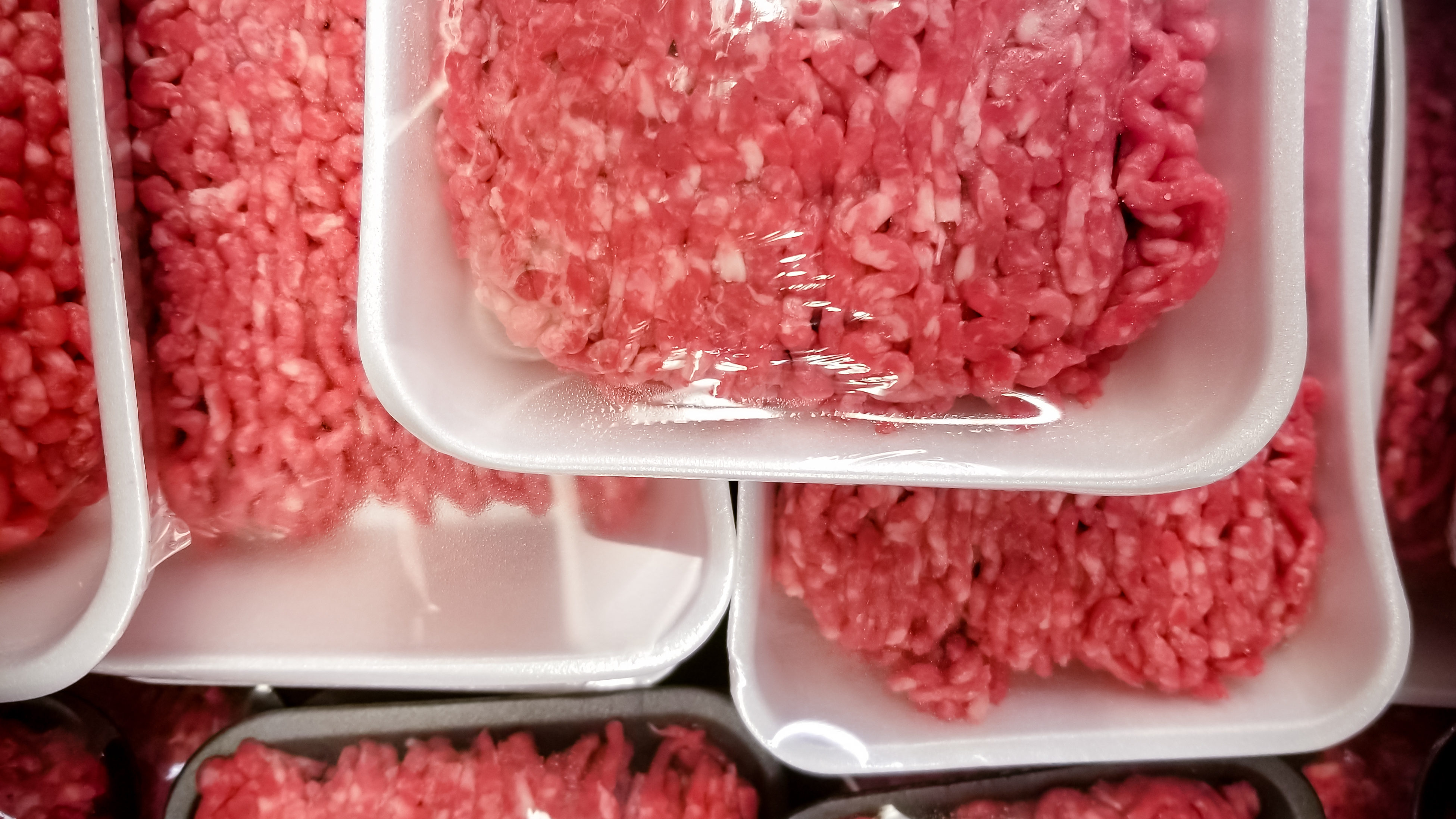 packaged hamburger meat on a grocery store shelf