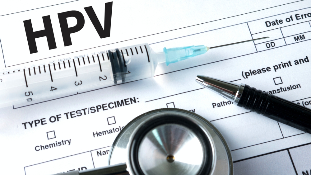 Virus vaccine with syringe and stethoscope HPV criteria paper for medical record