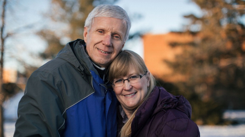 Beverly and Dr. Deyo-Svendsen in Menomonie, Wisconsin outside, bundled up in winter coats and smiling