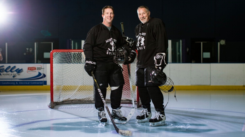 Donn D. Dexter, M.D., a neurologist, and Patrick L. Roberts, D.P.M., chair of the Division of Podiatry Mayo Clinic Health System on the ice in hockey gear