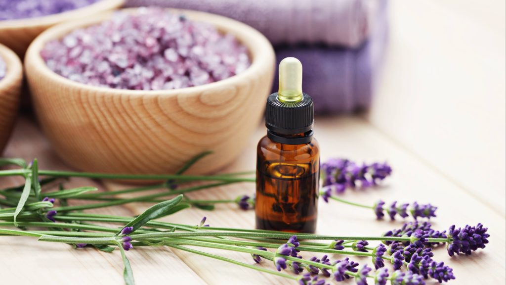 aromatherapy oil and bowl of lavender bath salt