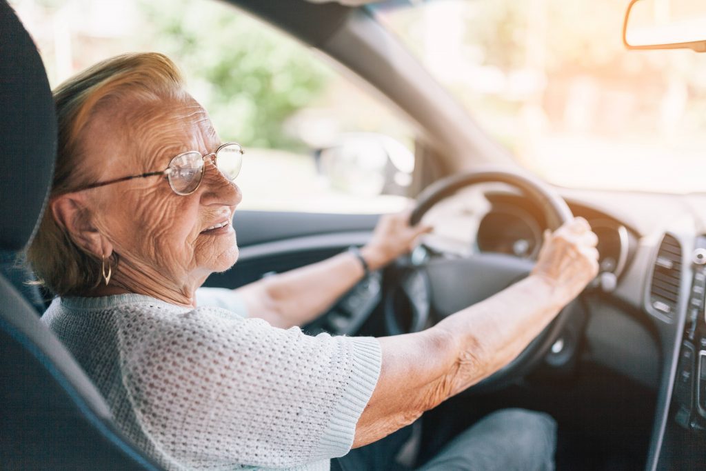 Elderly woman driving car