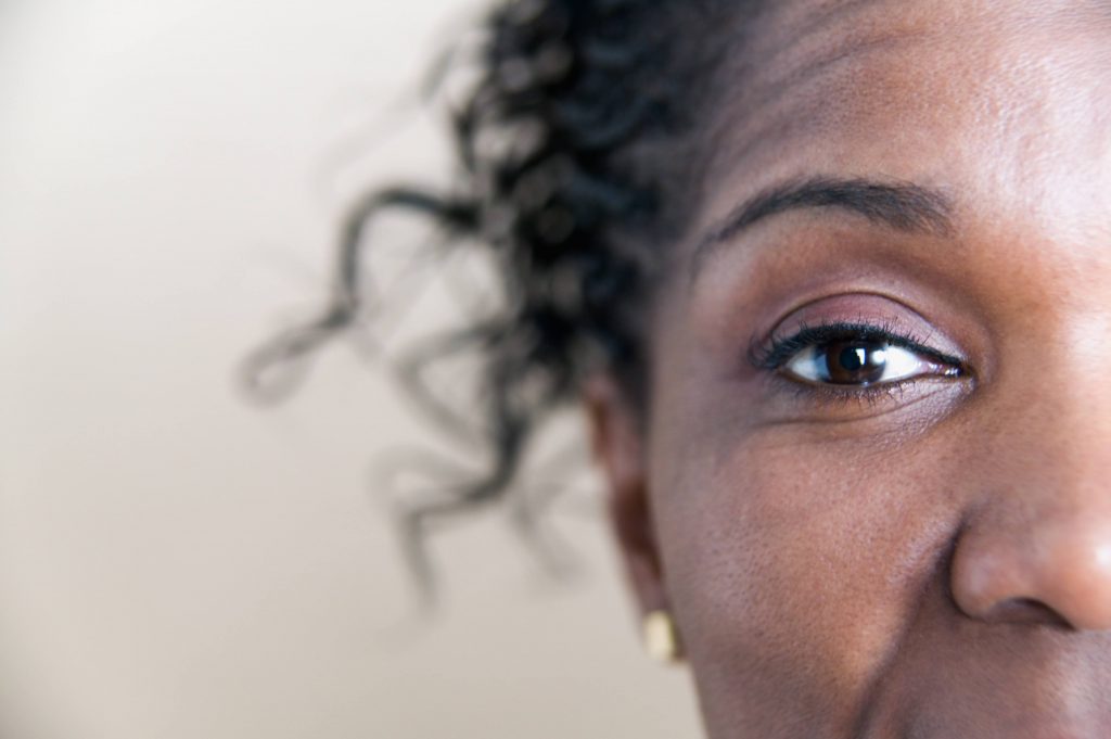 a close-up of a middle-aged Black woman's right eye