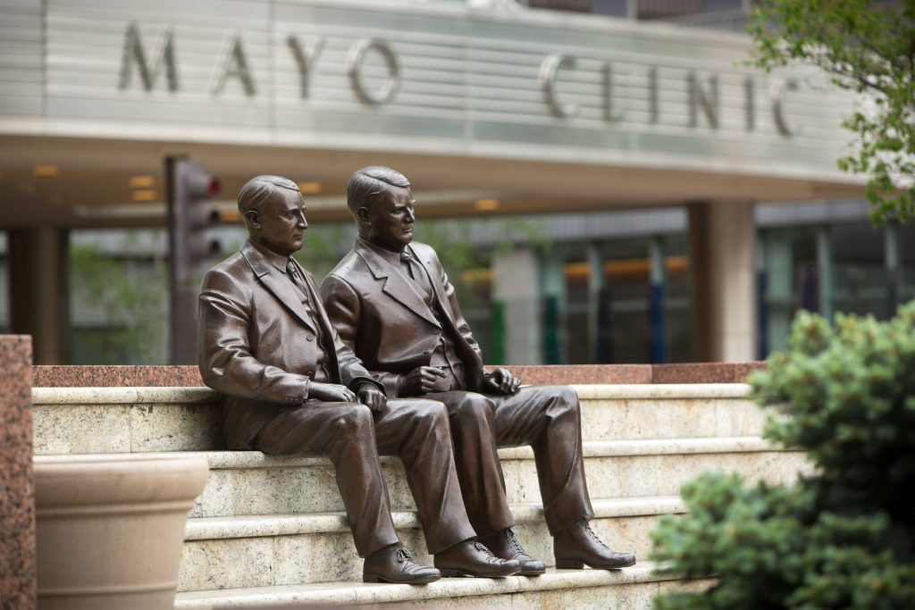 the bronze statues of the Mayo Brothers on steps outside the Gonda Building