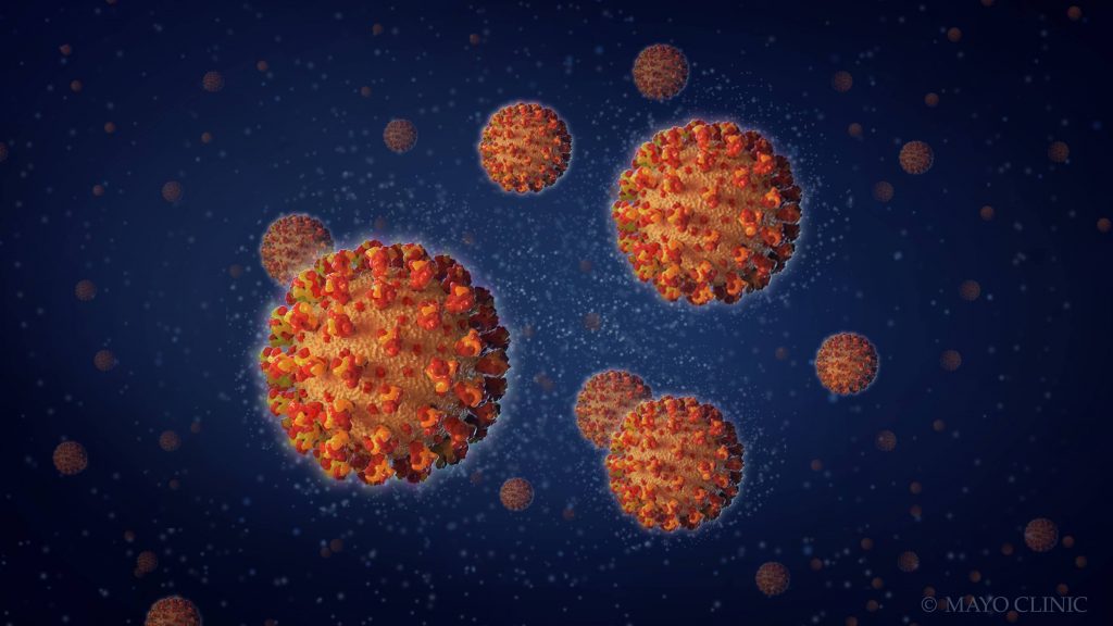 a medical illustration of orange coronavirus with a dark blue background