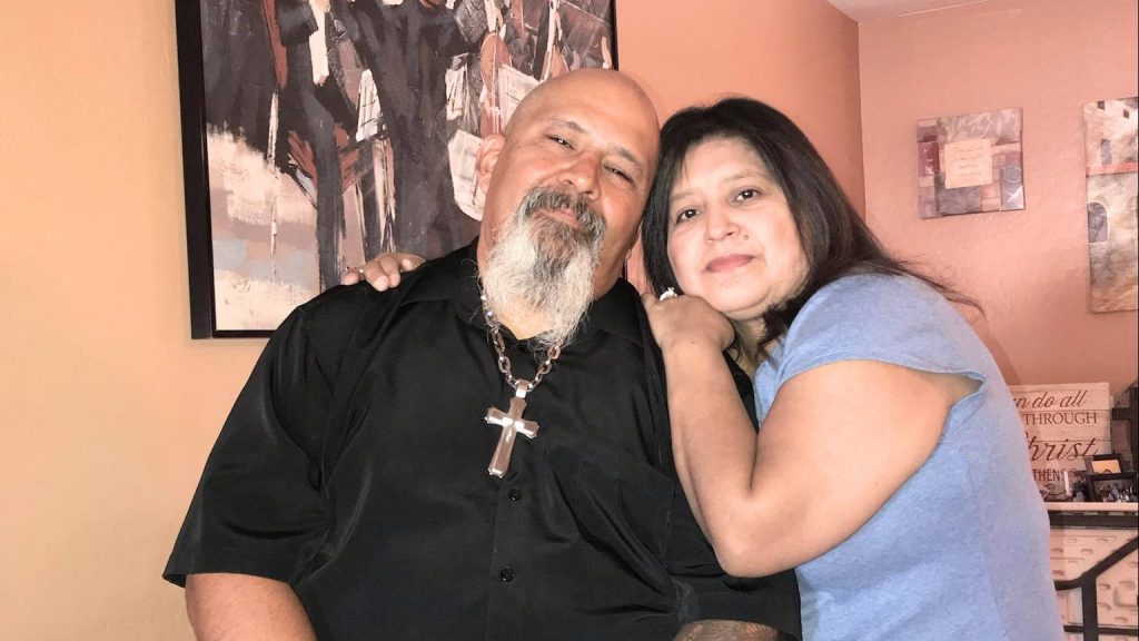 heart liver transplant patient Ernie Hernandez in his home with his wife Liz leaning on his shoulder