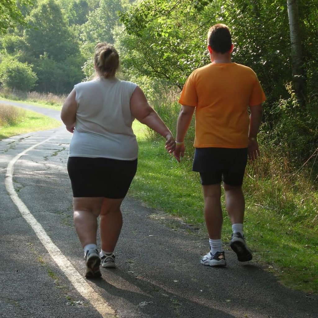 two people walking outside