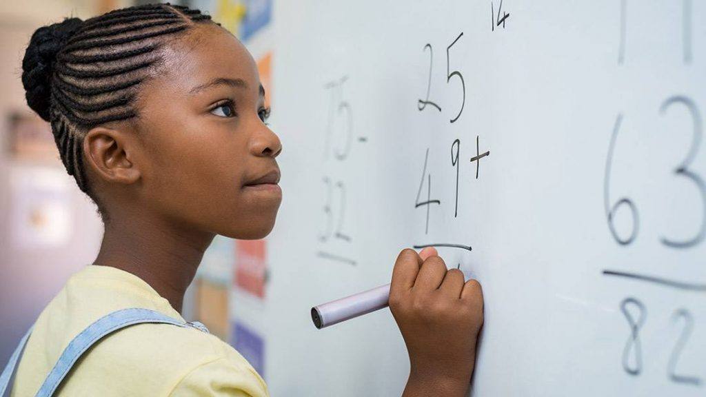 Young African American student solving a math problem