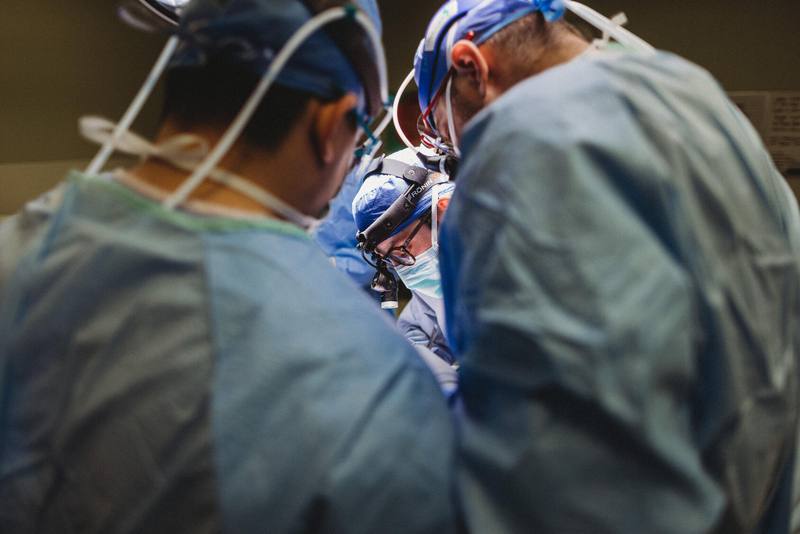 a closeup of three Mayo Clinic medical staff members in an operating room