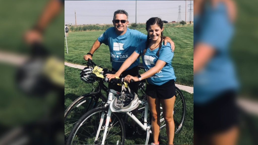 Tim and Carly Kelly, with their bikes, preparing for the Transplant Games of America
