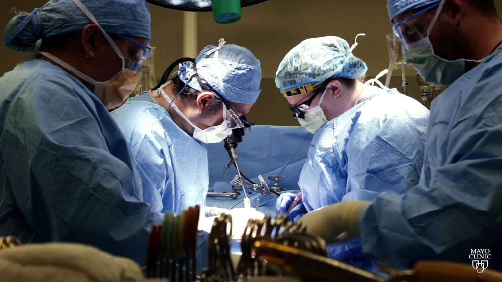 Medical staff in the operating room performing a heart transplant