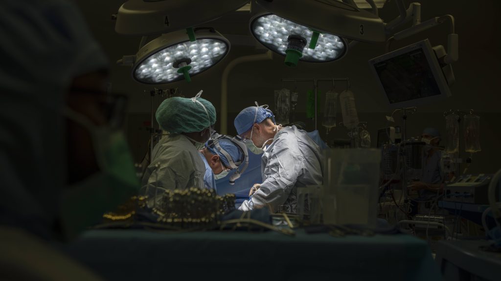 surgeons performing a transplant surgery