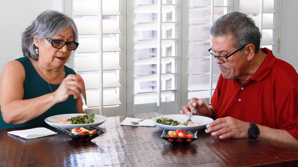photo of man and woman eating balanced meal. Patient had liver disease.