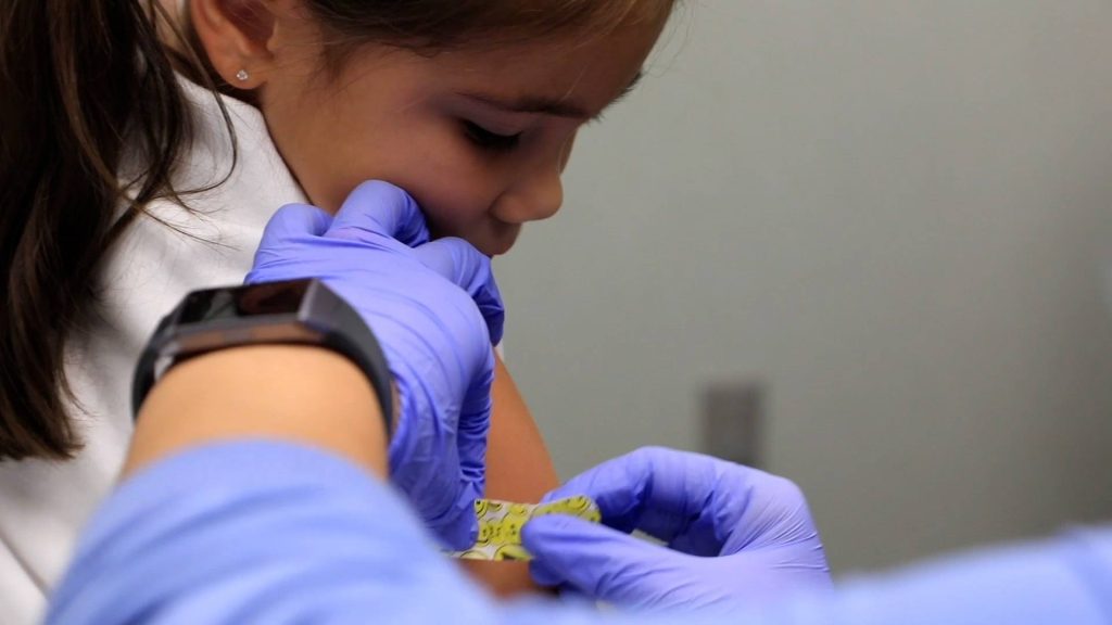 Young girl back to school vaccination