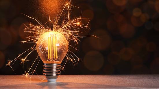 Image of a lightbulb with sparks