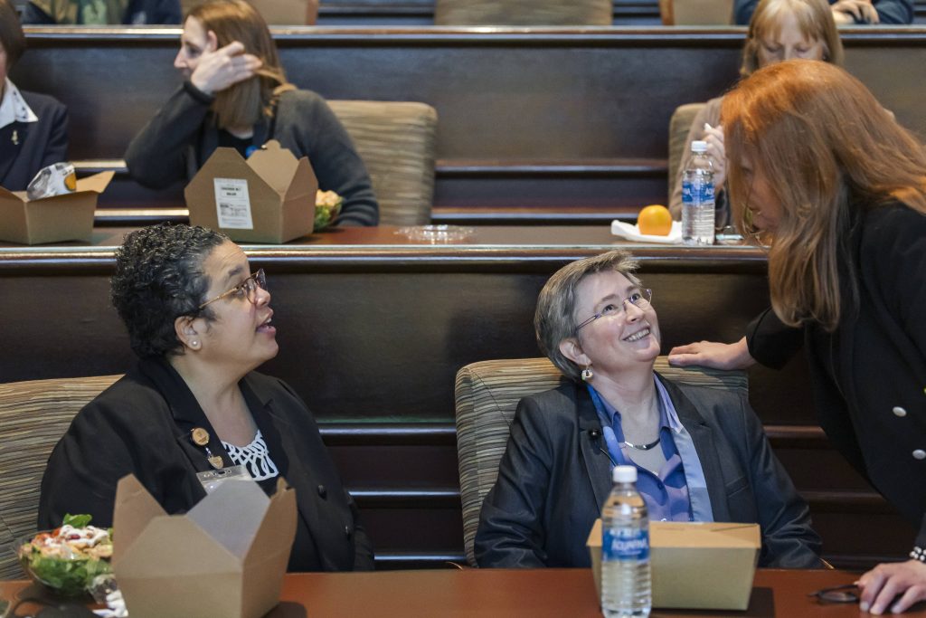 Image of Felicity Enders, Ph.D., left, and Vesna Garovic, M.D., Ph.D., right, chat with Joni Rutter, Ph.D., before the lecture begins.