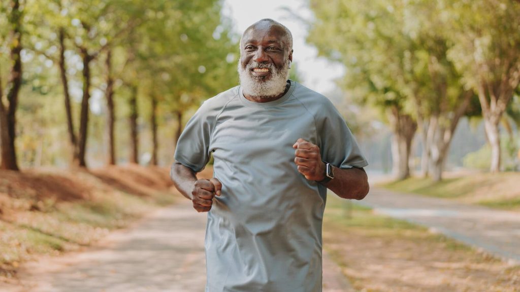 Older man outside running, jogging, exercise