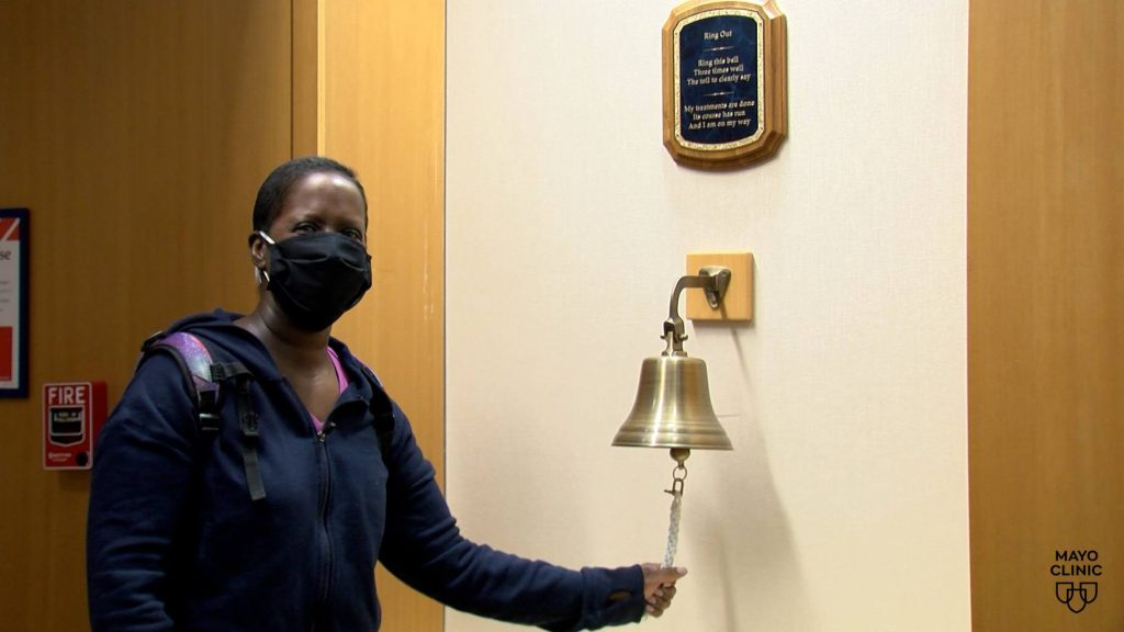 Sonya Goins rings bell after completing treatment for breast cancer