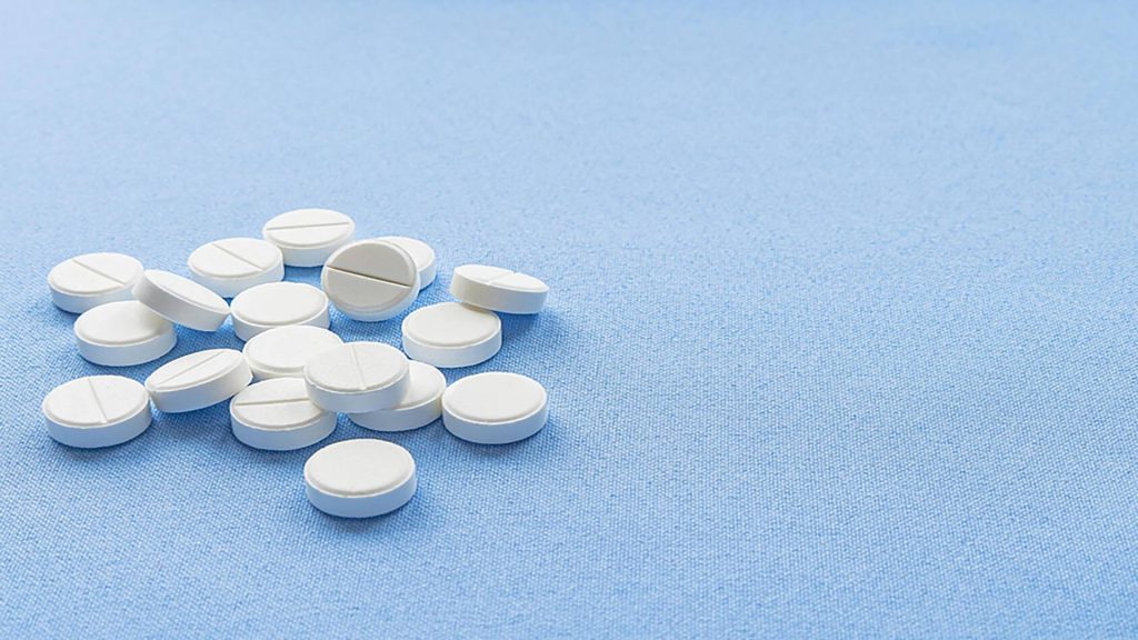 Tablets isolated on a blue background.