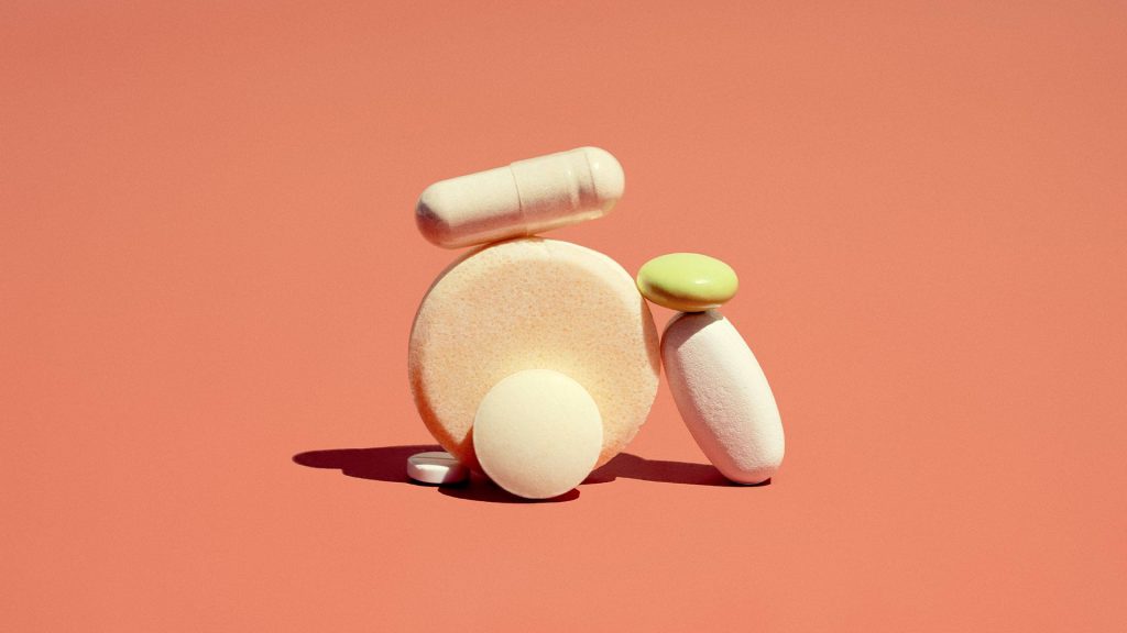 Pills against orange background