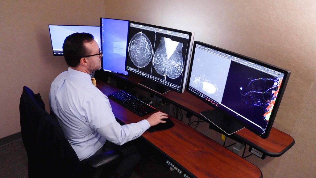 Dr. Richard Sharpe looks at breast images from MRI screening